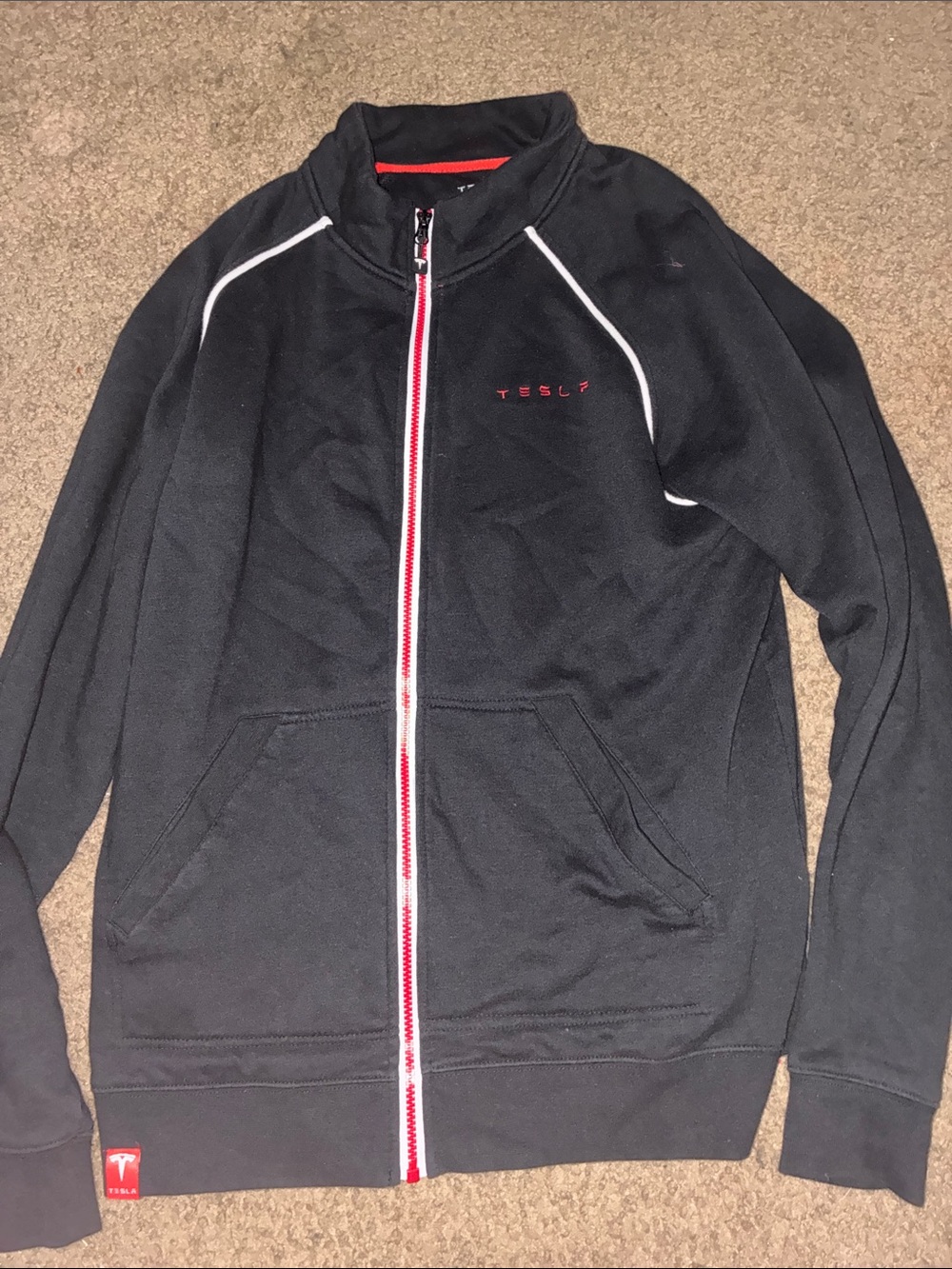Tesla Men’s Black Zip-Up Jacket with Red Accents and White Piping